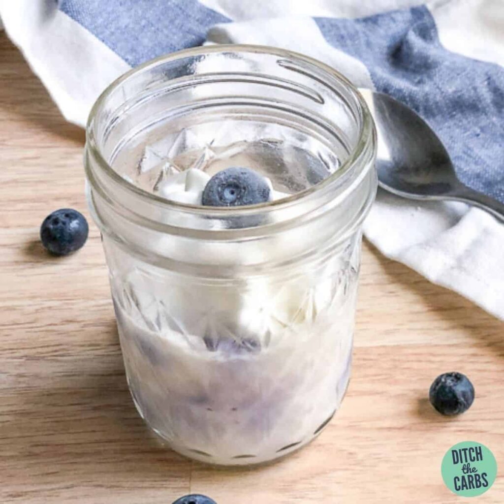 blueberry keto mug cheesecake in a glass mason jar