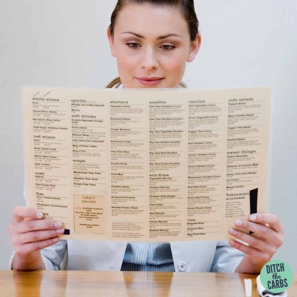 woman reading a keto menu