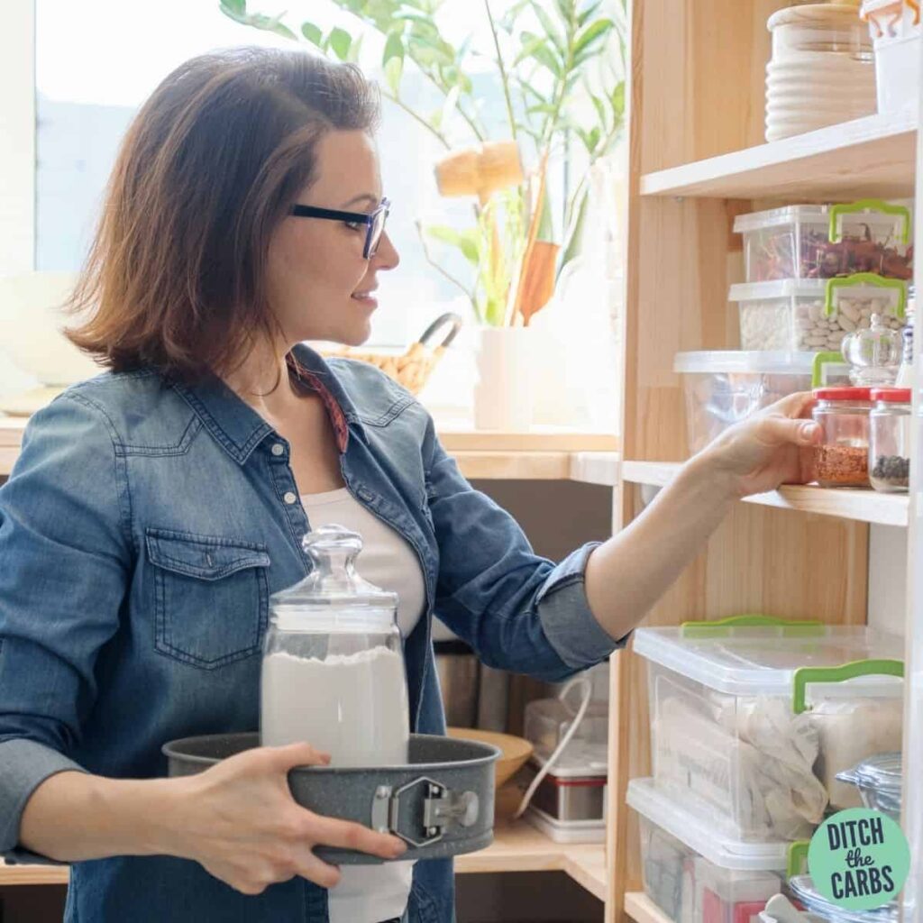 a women stocking her pantry with keto ingredients