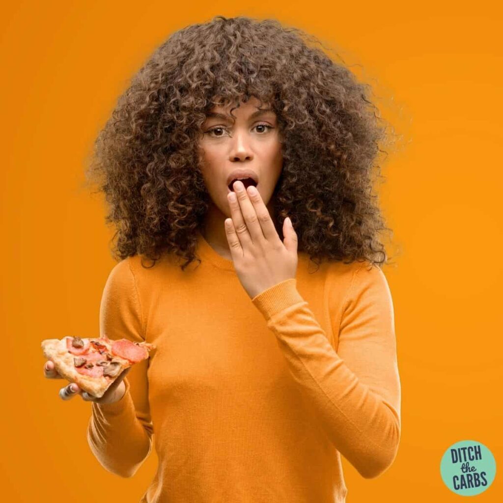 woman eating pizza wondering about the Top 3 Mistakes When Starting Low-Carb and Keto Diets